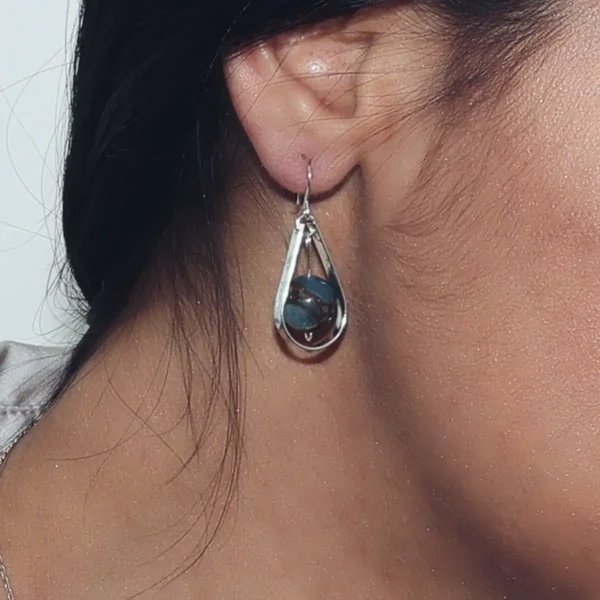 En Mi handmade earrings. Sterling silver teardrop earrings accented with turquoise beads.